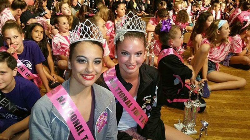 Two Girls Wearing A Crown